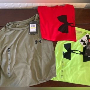 Four UnderArmour shirts, including two new with tags